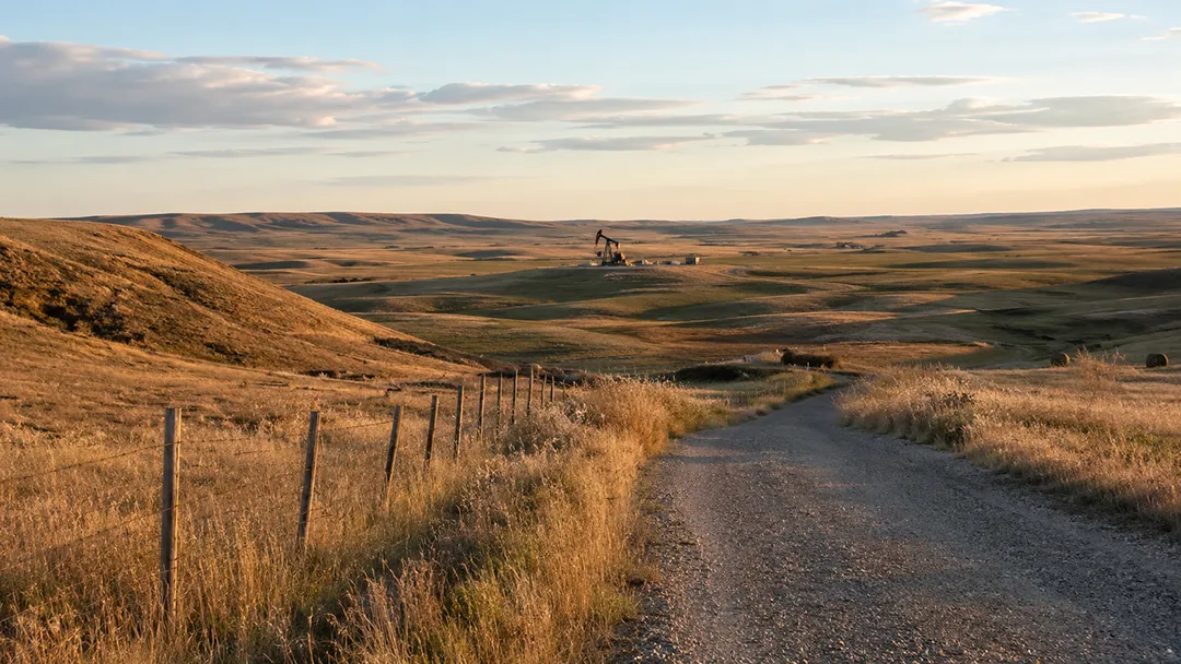 Rural-land-with-distant-oilfield-equipment-representing-surface-and-mineral-estate-ownership-Mineral-Rights-for-Sale